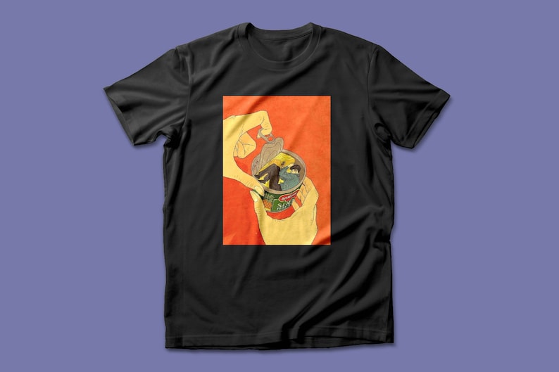 May include: A black t-shirt with a graphic of a hand opening a can of soup. The can contains a person lying down inside the soup.