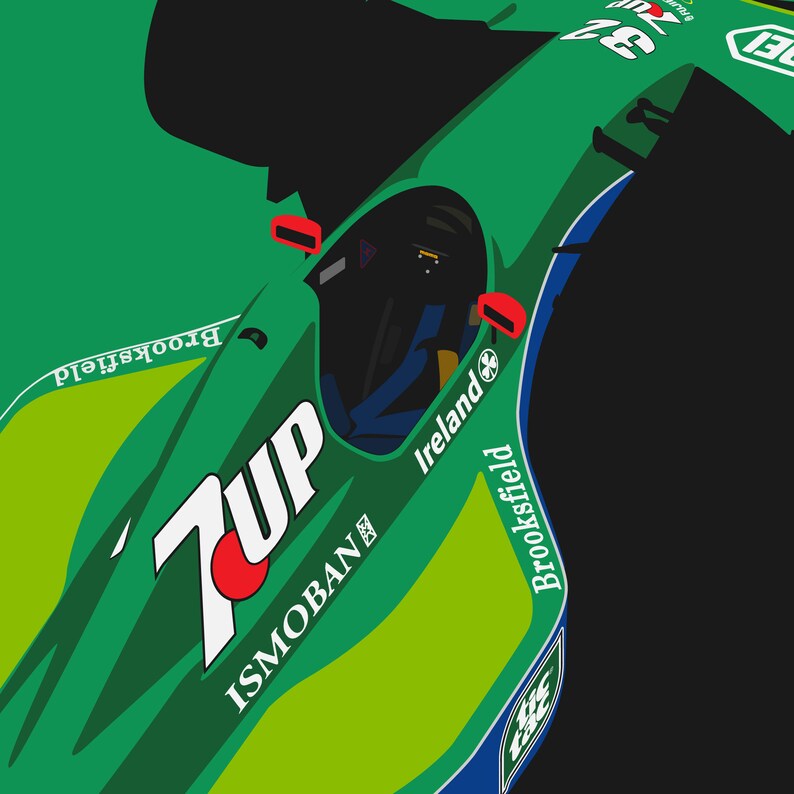 May include: A green and blue racing car with the words "7Up", "Ismoban", "Ireland", and "Brookfield" on the side. The car has a red circle with a white dot in the centre.