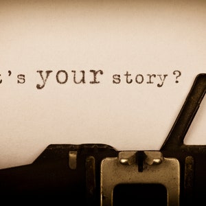 May include: A vintage typewriter with the phrase "What's your story?" typed on a sheet of paper.