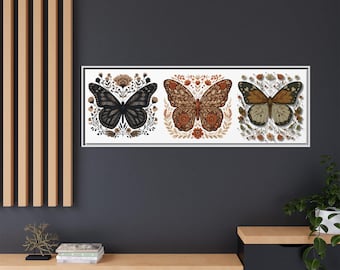 May include: A rectangular wall art piece featuring three distinct butterflies centered within floral wreaths. The left butterfly is black, the center is rust-orange, and the right is brown and cream. Each is detailed with intricate patterns.