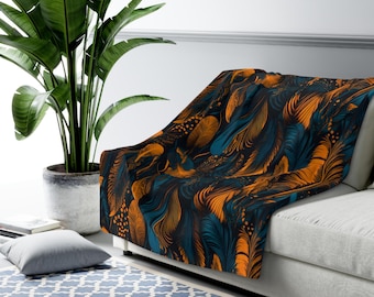 Manta de sherpa bohemia con estampado de plumas naranjas y verde azulado, decoración bohemia acogedora