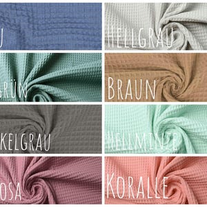 May include: A collection of waffle fabric swatches in various colors, including blue, green, gray, brown, mint, and pink. The fabric is textured and has a waffle-like pattern. The colors are labeled in German.