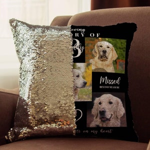 May include: A gold sequin pillow with a black and white photo collage of golden retrievers. The text on the pillow reads "Loving Memory of Buddy Missed Beyond Measure He's on my heart".
