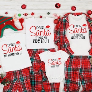 May include: A set of four white t-shirts with red text that says "Dear Santa" and a different reason for bad behavior on each shirt. The shirts are paired with red and green plaid pajama pants.