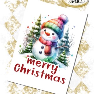 May include: A watercolour illustration of a snowman wearing a rainbow hat and scarf, set against a snowy forest backdrop. The words "merry Christmas" are written in red script. The image is labelled "DIGITAL DOWNLOAD".