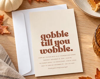 May include: A cream-coloured rectangular invitation card with a white envelope featuring the brown text "gobble till you wobble." and details for a Thanksgiving dinner on Thursday, November 26, 2026, at 4:00 PM at The Parker House in Austin, Texas.