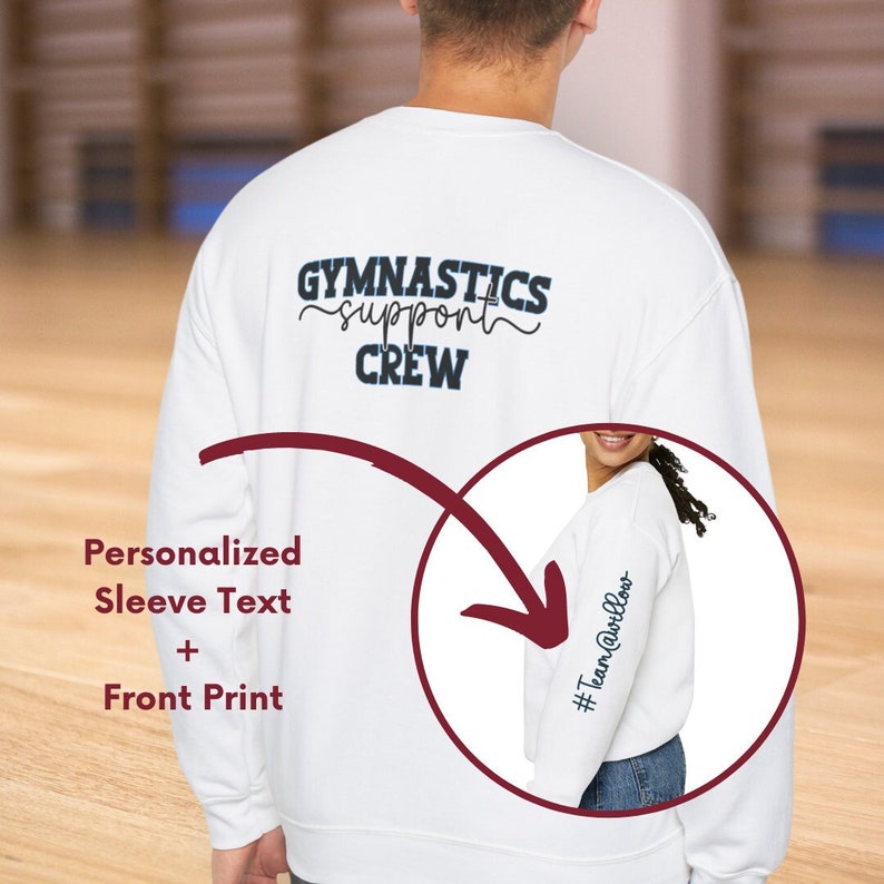 May include: White sweatshirt with the text "Gymnastics support crew" on the back. The sweatshirt has a personalized sleeve text option, shown as "#TeamAwesomeness".
