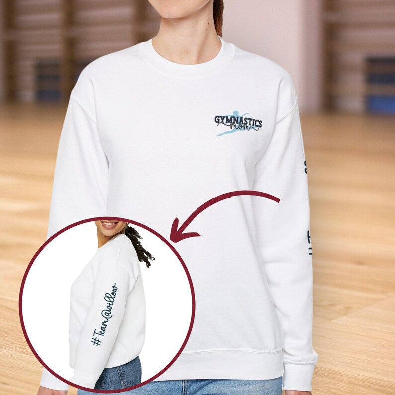May include: White sweatshirt with the text "GYMNASTICS" and a stylized gymnast on the front. The left sleeve has the text "#TeamWillows" in blue.