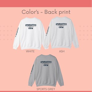 May include: Three sweatshirts in white, ash grey, and sports grey with the text "Gymnastics Support Crew" printed on the back. The text is in a blue script font with a white outline. The sweatshirts have long sleeves and a crew neck.