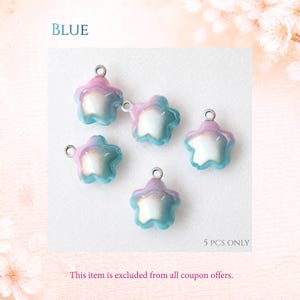 May include: Five star-shaped charms with a gradient finish transitioning from pink at the top to blue at the bottom, featuring a pearlescent white center. Each charm includes a small silver-toned metal jump ring at the top. Text reads BLUE and 5 PCS ONLY.