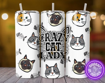 May include: A white tumbler with a straw, featuring a repeating pattern of cat faces and fish bones. The words "Crazy Cat Lady" are displayed prominently. The tumbler has a silver lid and straw.