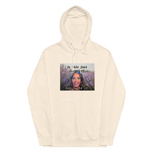 May include: A cream-colored hoodie with a graphic print of a woman in a field of purple flowers. The text on the graphic reads "Is this just lavender? Cuz I ate it."