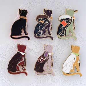 May include: Six enamel pins featuring black cats in different outfits. The cats are wearing a variety of clothing, including a suit, a doctor's coat, a detective's coat, a robe, and a tuxedo. The pins are all gold-toned and have a glossy finish.