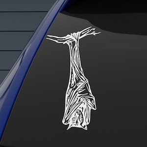 May include: A white vinyl decal of a bat hanging upside down with its wings spread out.