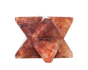 May include: A geometric, star-shaped sculpture carved from a reddish-brown stone. The sculpture features intersecting triangular planes, showcasing natural variations in color and texture. The object is a decorative item.