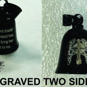 May include: Black metal bell with a cross and wings engraved on one side and the text "My Lord shield and protect her, always bring her home to me." engraved on the other side.