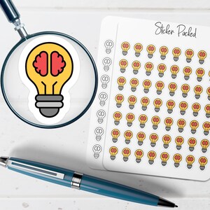 May include: A sheet of stickers with a repeating pattern of yellow light bulbs with red brain designs. The stickers are labeled "Sticker Packed". A magnifying glass and a blue pen are in the image.