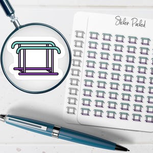 May include: A sticker sheet with multiple stickers of a gymnastics bar in teal, purple, and black. The stickers are on a white background. A magnifying glass is over one sticker. A blue pen is in the foreground.