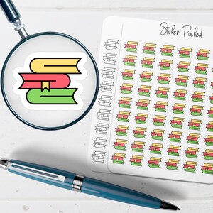 May include: A sticker sheet with the text "Sticker Packed" and multiple stickers of stacked books in yellow, red, and green. A magnifying glass focuses on a single book sticker. A blue pen is also in the image.
