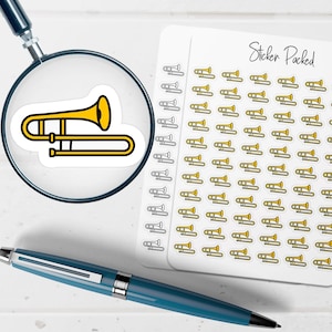 May include: A collection of trombone stickers, each featuring a yellow and black design. The stickers are on a white background, with the words "Sticker Packed" in cursive. A magnifying glass and a blue pen are also in the image.