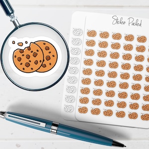 May include: A sheet of stickers featuring a repeating pattern of chocolate chip cookies. The stickers are brown with dark brown chocolate chips and a white border. The text "Sticker Packed" is written in black script.