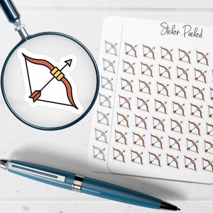 May include: A sheet of stickers with a repeating pattern of Sagittarius bow and arrow designs. A single sticker is magnified by a magnifying glass. A blue pen is in the foreground. The words "Sticker Packed" are written on the sticker sheet.