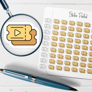 May include: A sheet of stickers with a repeating pattern of small, yellow ticket-shaped designs with a play button symbol. The stickers are next to a magnifying glass with a larger ticket sticker and a blue pen.