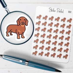 May include: A sheet of dachshund stickers featuring a brown dog illustration. The stickers are on a white background with the text "Sticker Packed" and the number "0312". A magnifying glass and a blue pen are also in the image.