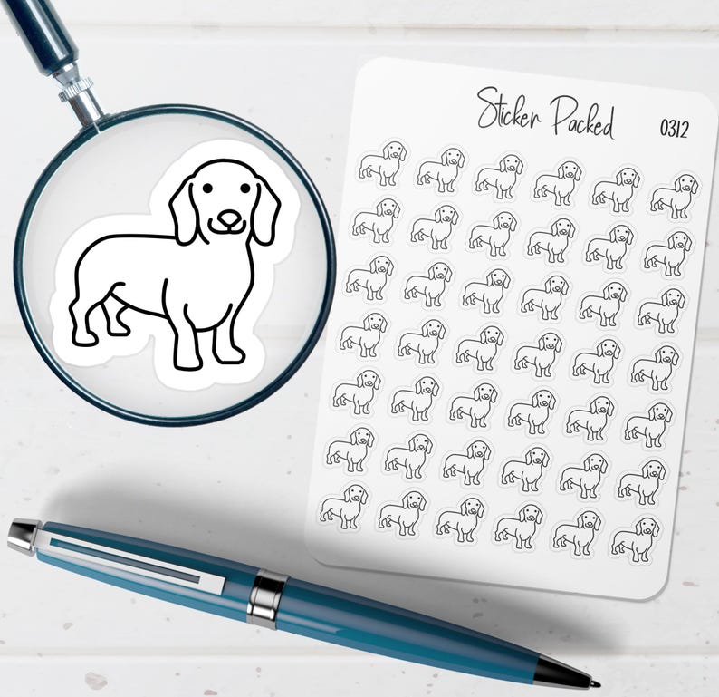 May include: A sheet of stickers with a repeating outline of a dachshund dog. The stickers are black and white. A magnifying glass shows a close-up of one sticker. A blue pen is in the foreground.