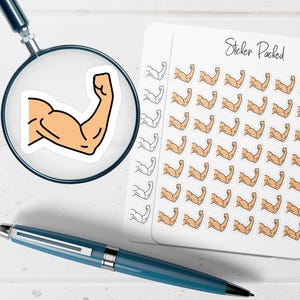May include: A sticker sheet with multiple stickers of a flexing arm in a tan color with black outlines. A magnifying glass shows a close-up of one sticker. A blue pen is in the foreground. The sticker sheet has the words "Sticker Packed".
