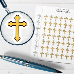 May include: A sheet of stickers with gold crosses, a large cross under a magnifying glass, and a blue pen. The stickers are labeled "Sticker Packed". The cross stickers have a gold center with a black outline.