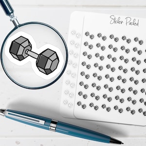 May include: A sticker sheet featuring small, gray dumbbell stickers. A single dumbbell sticker is magnified by a magnifying glass. The words "Sticker Packed" are written in cursive on the sticker sheet. A blue pen is in the foreground.