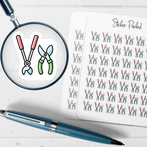 May include: A sheet of stickers featuring gardening tools, including pruning shears and loppers. The stickers are in a cartoon style with red, green, and blue accents. The text "Sticker Packed" is visible on the sheet.