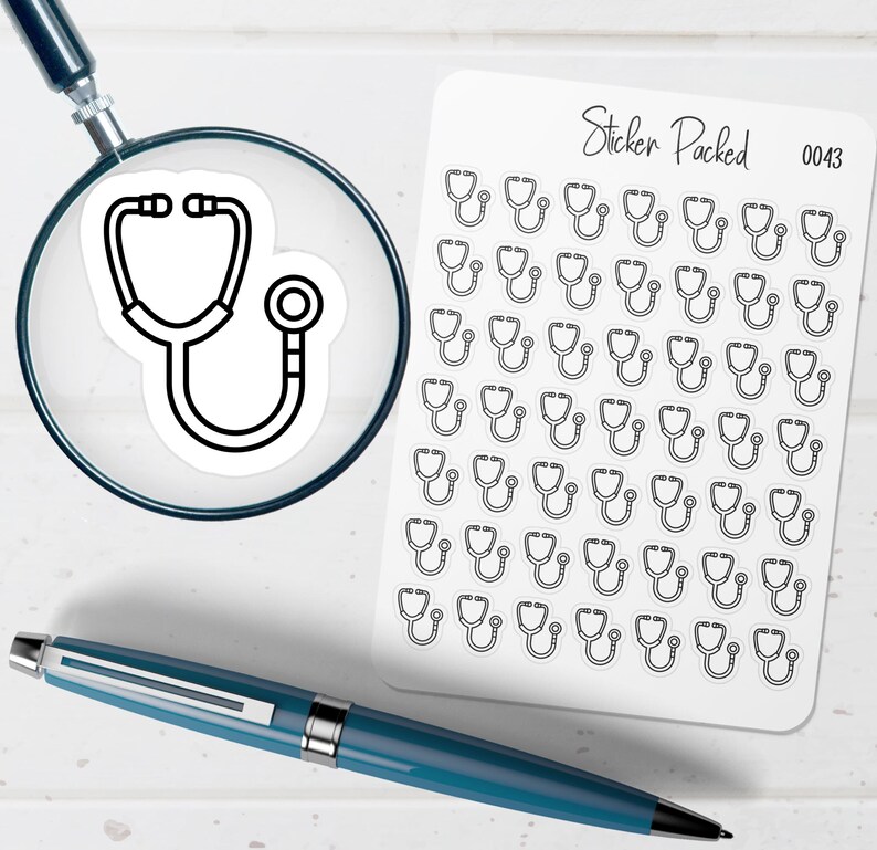 May include: A sheet of stickers featuring a stethoscope design, with the text "Sticker Packed 0043". A magnifying glass shows a single stethoscope sticker. A blue pen is also in the image.