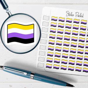 May include: A collection of non-binary pride flag stickers. The stickers feature a yellow, white, purple, and black flag design. A magnifying glass focuses on a single sticker. A blue pen rests on the white surface next to the stickers. The words "Sticker Packed" are written on the sticker sheet.