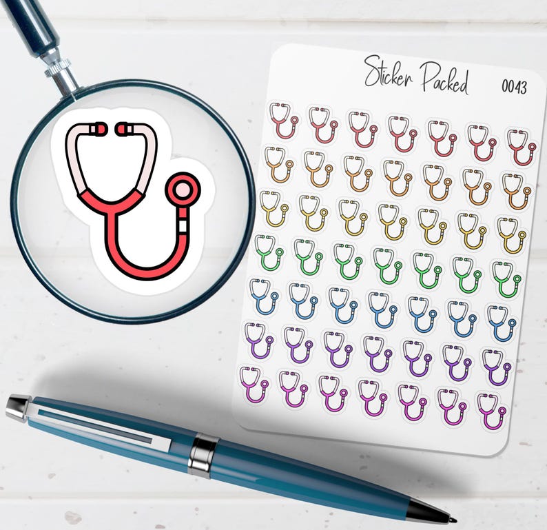 May include: A sticker sheet with multiple colorful stethoscope stickers. A single stethoscope sticker is magnified by a magnifying glass. A blue pen is also in the image. The sticker sheet has the text "Sticker Packed" and the number "0043".