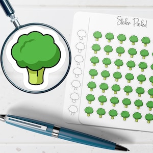 May include: A sheet of stickers featuring green broccoli illustrations. A magnifying glass focuses on a single broccoli sticker. A blue pen is in the foreground. The sheet of stickers has the text "Sticker Packed".