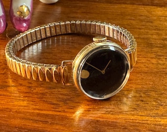Raro relógio vintage suíço Movado Zenith em ouro 14K com corda manual e 17 rubis.