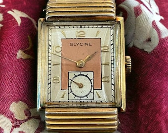 Seltene Glycine-Uhr aus den 40er-Jahren mit rechteckigem Zifferblatt und lachsfarbenem Zifferblatt, läuft wunderbar