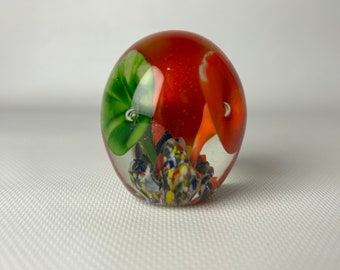 Vintage decorative glass paperweight.  Egg shaped. Bubbles. Art glass. St Clair art style. Flowers. Trumpet Flowers. 1970s