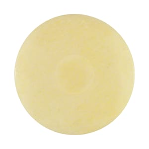 May include: A round, pale yellow bar of soap with a slightly indented center.