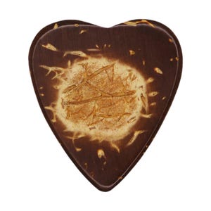 May include: A heart-shaped wooden box with a dark brown exterior and a lighter, textured center. The center has a golden-brown, sunburst-like pattern. The box is likely used for storing small items or as a decorative piece.
