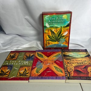 May include: A boxed set titled The Four Agreements Toltec Wisdom Collection by Don Miguel Ruiz, accompanied by three individual paperback books: The Four Agreements, The Mastery of Love, and The Voice of Knowledge, all featuring colorful, illustrated covers.