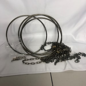 May include: A set of three metal hoops and a chain, likely for hanging a light fixture or other decorative items.