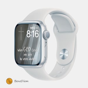 May include: A white Apple Watch with a white strap. The watch face shows the time 8:16, the day of the week "WED 11", and the text "When GOD closes one door He opens another".