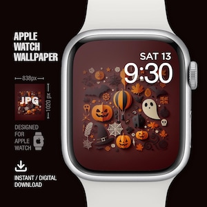 May include: A digital watch face with a Halloween theme. The watch face is brown with a variety of orange, white, and black paper cutouts. The time is displayed as 9:30 and the date is displayed as SAT 13.