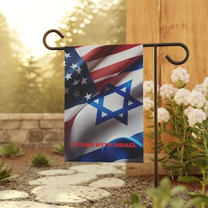 May include: A garden flag featuring the American and Israeli flags printed together. The flag has the text "I Stand With Israel" printed on it.