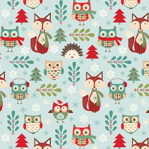May include: A repeating pattern on a light blue background featuring owls, foxes, Christmas trees, snowflakes, and sprigs of leaves. The owls and foxes are wearing scarves and earmuffs. The design has a festive, winter theme.