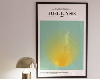 May include: A framed poster with a yellow and green gradient background. The poster has the text "It's time to let go of what's no longer serving you. RELEASE 999" printed on it.