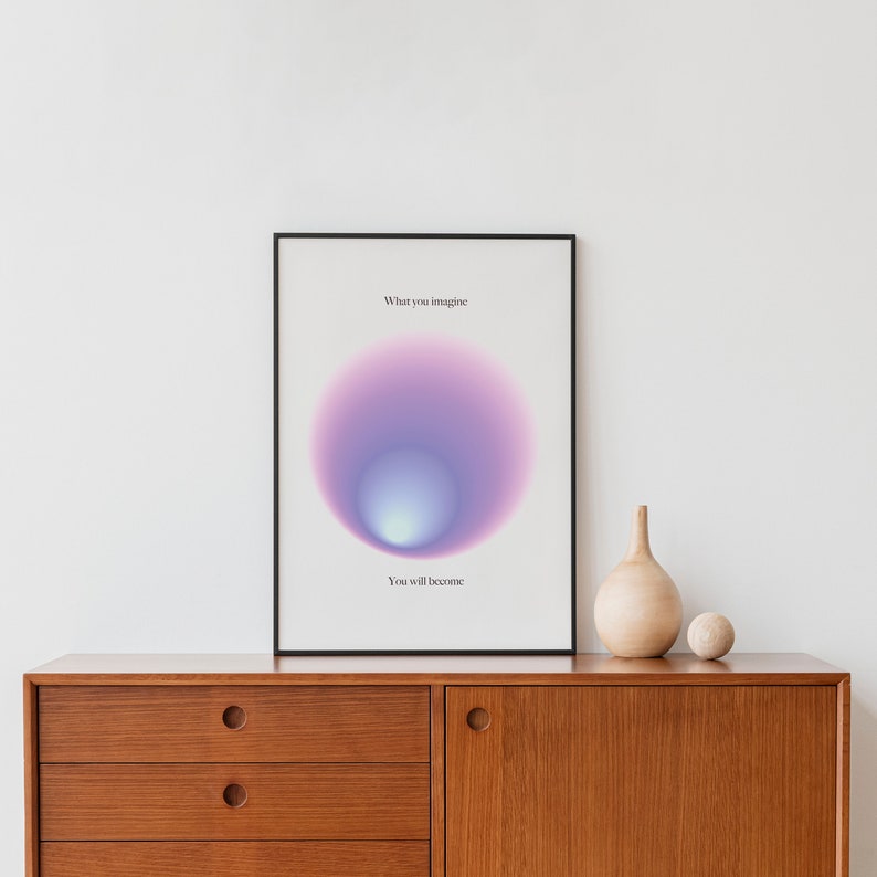 May include: A framed print with a purple and blue gradient circle and the text "What you imagine, You will become."
